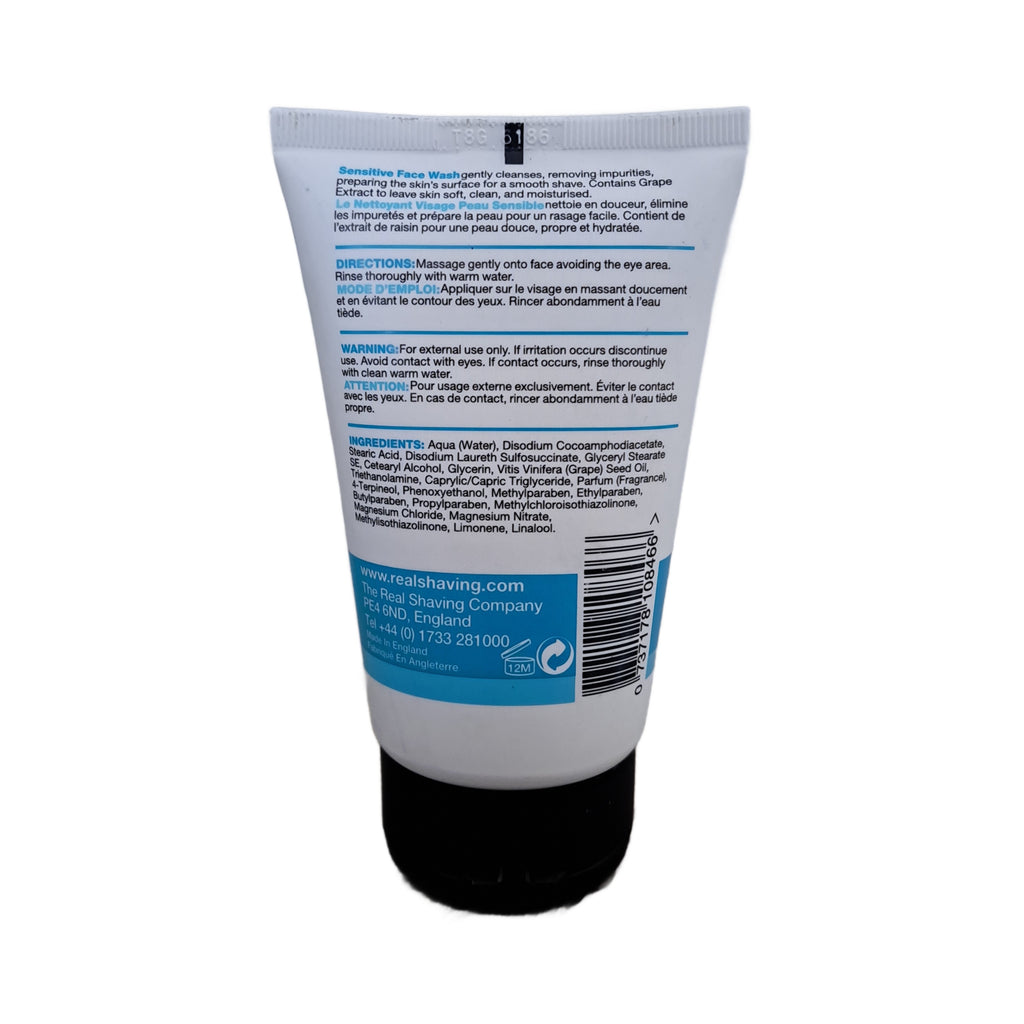 Back view of a shaving cream tube with text and branding on a white background