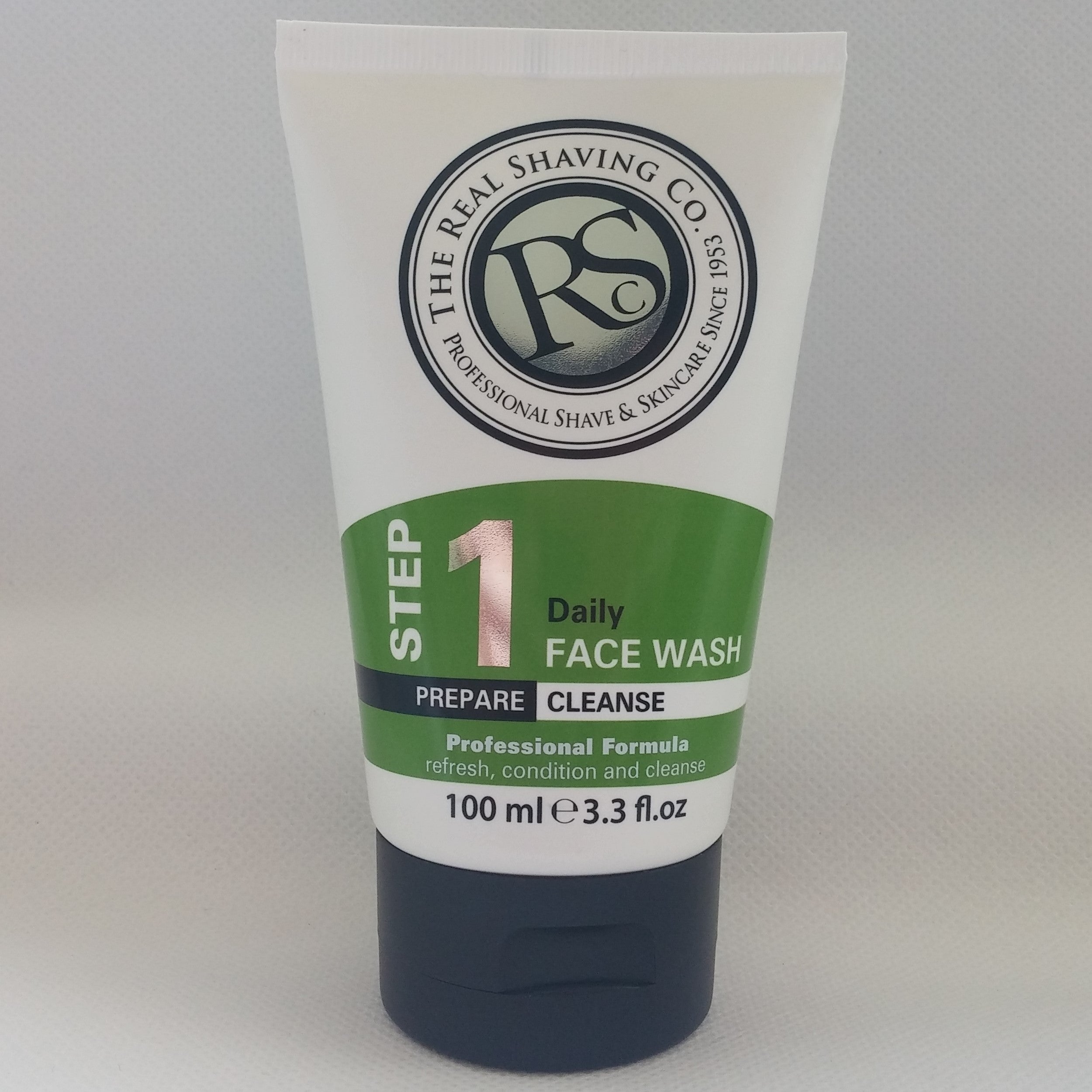 Tube of The Real Shaving Co. daily face wash on a gray background